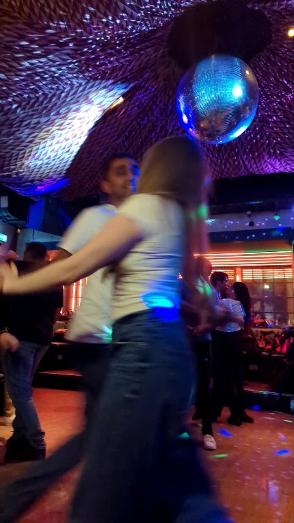 Social dancing under the disco lights